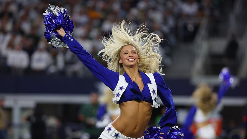 Cowboys cheerleader performs