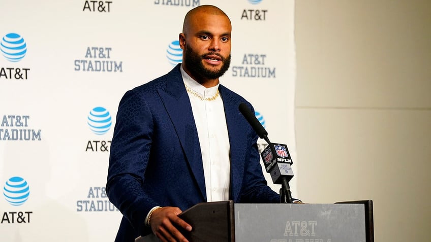 Dak Prescott talks to reporters