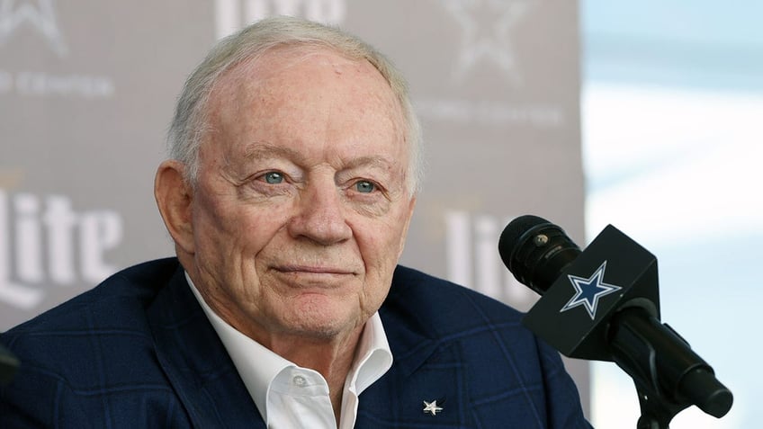 Jerry Jones talks to reporters