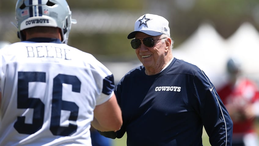 Jerry Jones interacting with a player