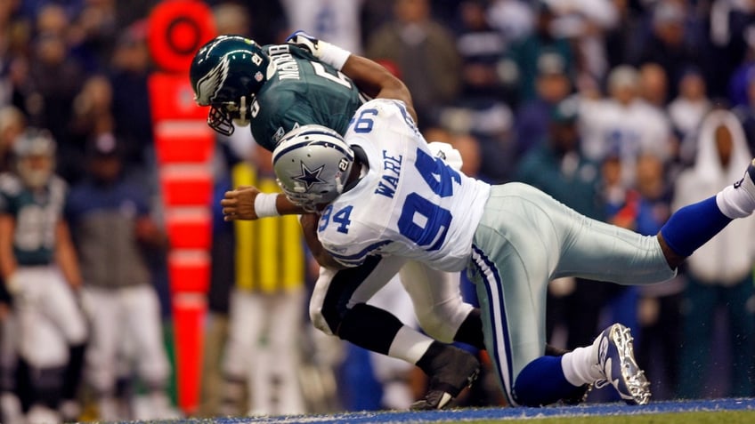 DeMarcus Ware of the Dallas Cowboys sacks Donovan McNabb (5) of the Philadelphia Eagles during the Eagles 10-6 win over the Cowboys at Texas Stadium in Irving, Texas.