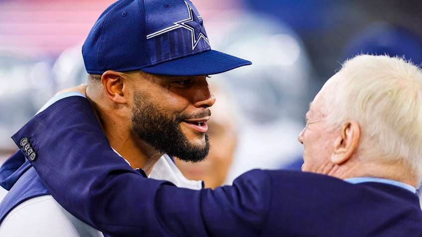 Dak Prescott speaks with Jerry Jones