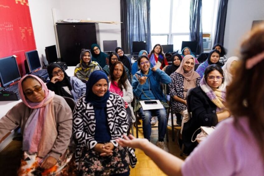 A class teaching new immigrants workplace related skills at the South Asian Women and Immi