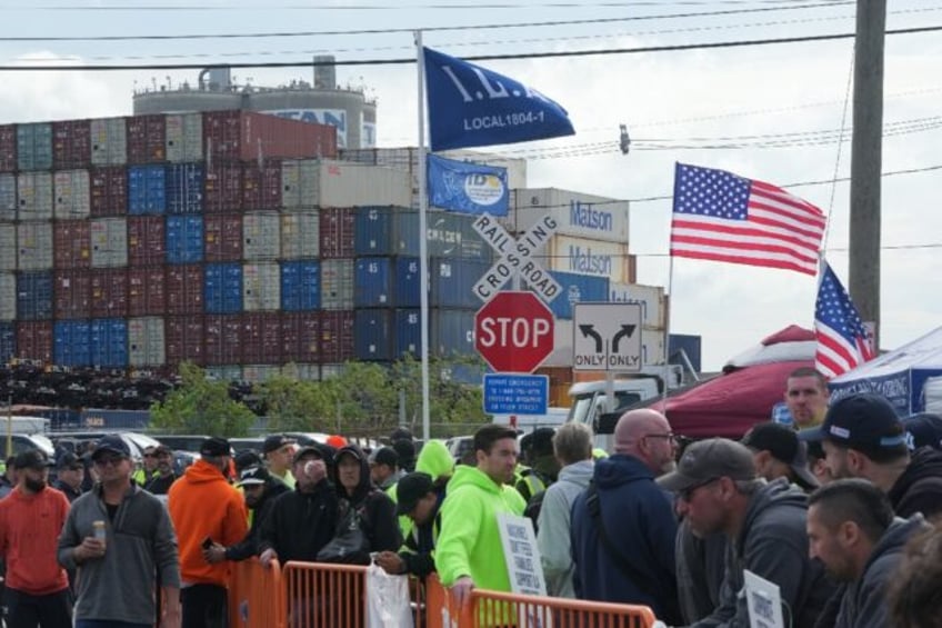 Shipping containers are stacked as dockworkers are on strike in Port Newark on October 1,