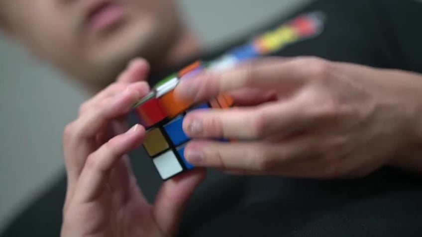 man with rubik's cube