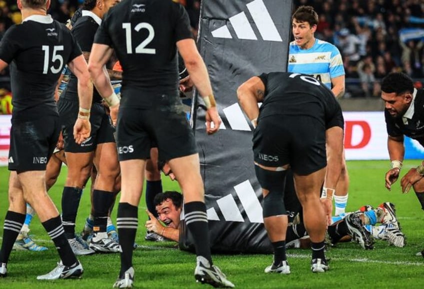 Argentina's Agustin Creevy (bottom, centre) celebrates scoring the clinching try against N