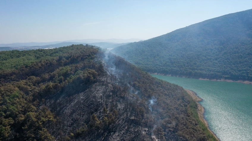 crews in turkey search for helicopter that crashed into lake while fighting forest fire