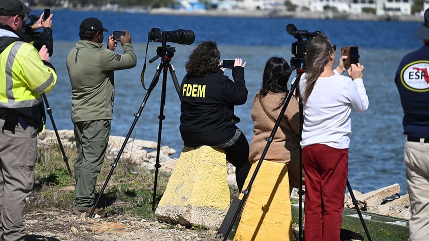 Onlookers watch FL bomb detonations