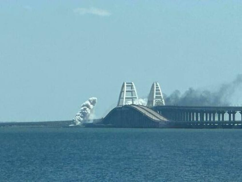 crimean bridge targeted by pair of missiles in rare daytime attack