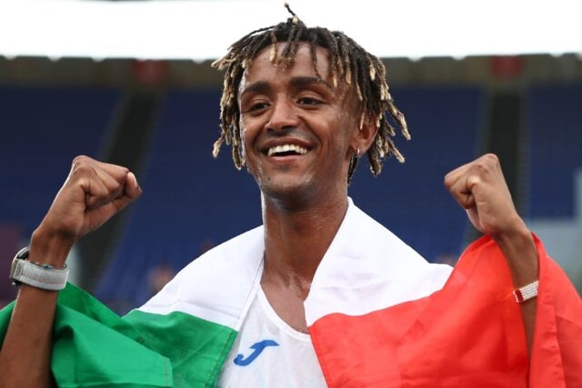 Italy's Yemaneberhan Crippa celebrates after winning the European men's half-marathon