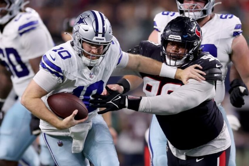 Under pressure: Dallas Cowboys reserve quarterback Cooper Rush struggles to evade Houston'