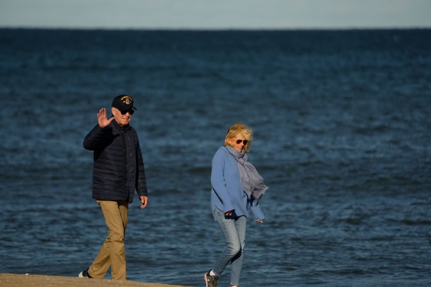 crisis what crisis biden enjoys breezy beach walk as middle east explodes