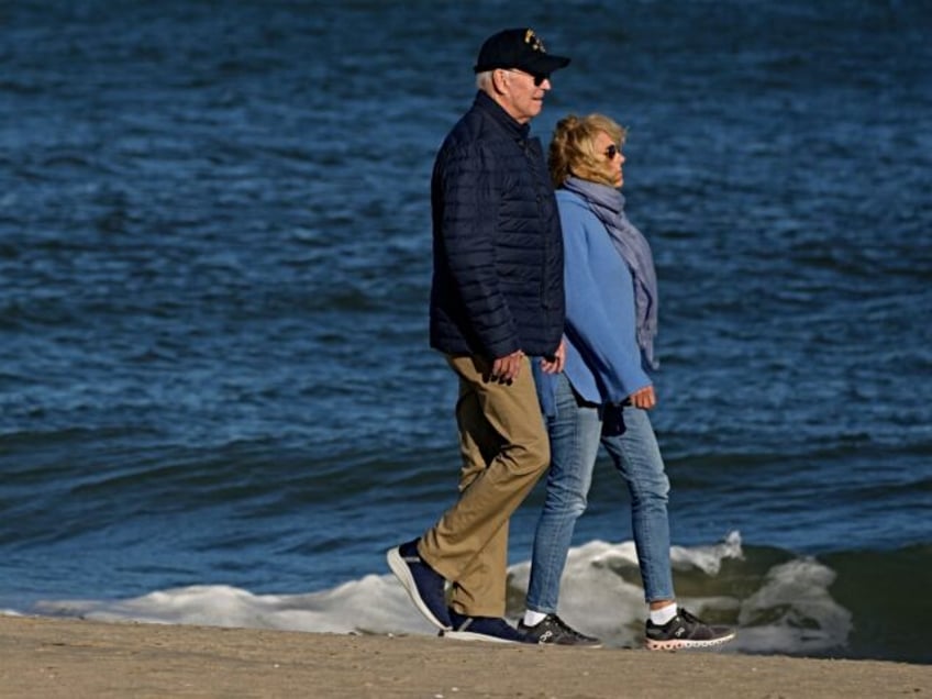 crisis what crisis biden enjoys breezy beach walk as middle east explodes