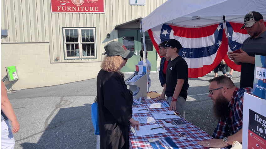 Volunteers help Scott Presler register voters at the Green Dragon Farmers Market in Ephrata, Pa., this month.