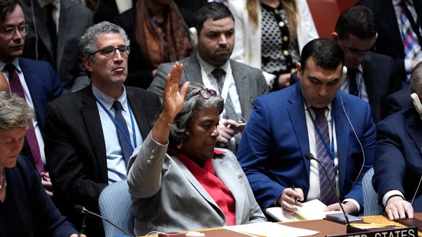 US UN Ambassador Linda Thomas Greenfield votes in a Security Council meeting on Gaza