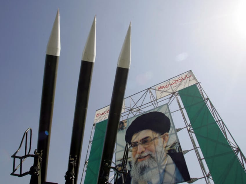 TEHRAN, IRAN: Russian-made Sam-6 surface-to-air missiles are seen in front of a portrait o
