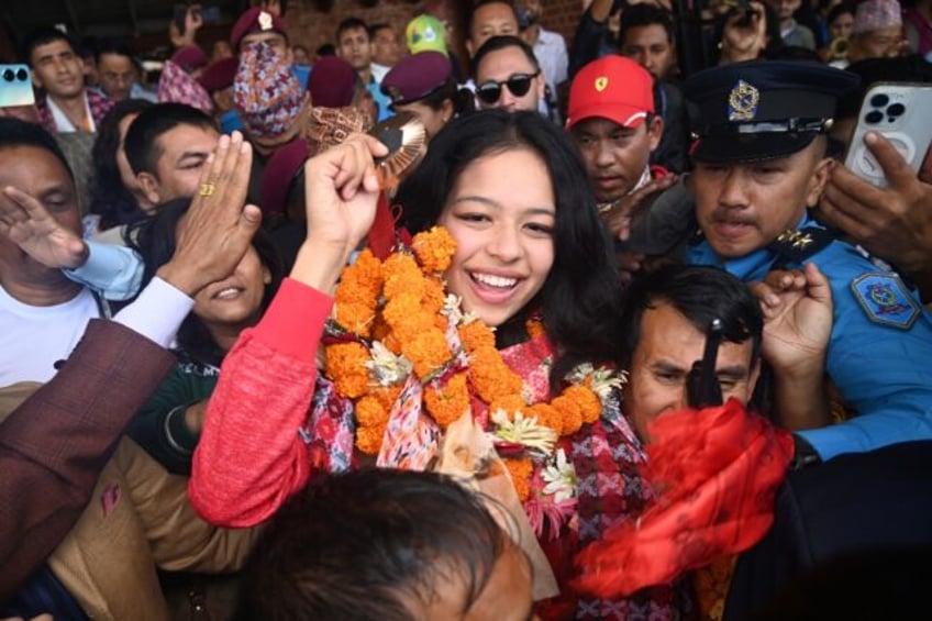 Paralympics taekwondo bronze medallist Palesha Goverdhan is mobbed by crowds on her arriv