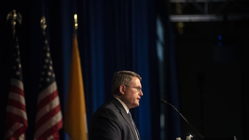 Leonard Leo at podium speaking in 2019