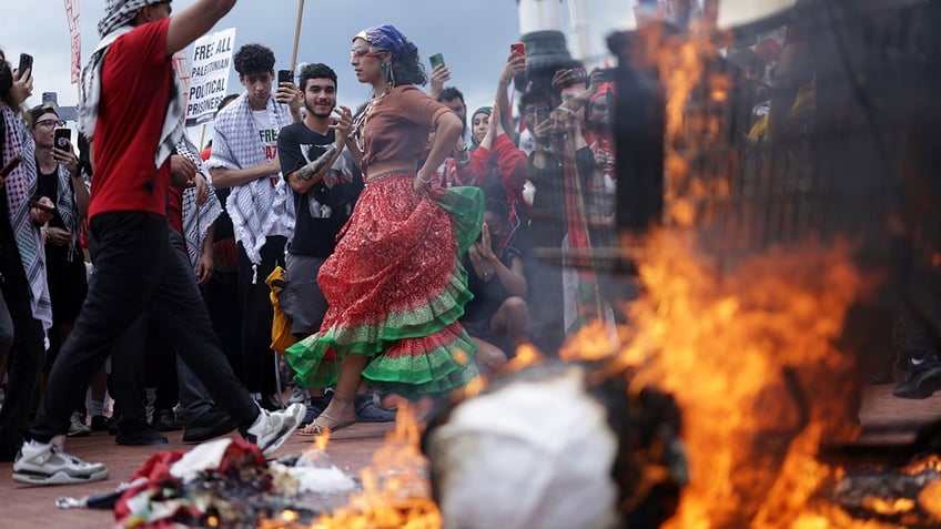 activists burn U.S. flag outside DC's Union Station