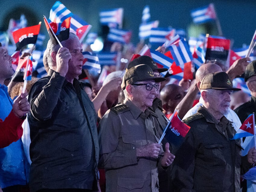 TOPSHOT - (L to R) Cuban Prime Minister Manuel Marrero Cruz, Cuban President Miguel Diaz-C