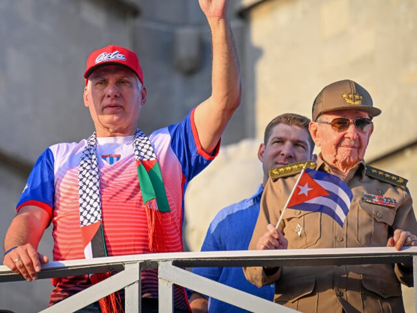 Cuba's President and First Secretary Miguel Diaz-Canel (C) and former President Raul