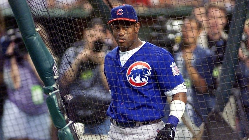 Sammy Sosa looks on