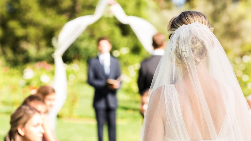 Bride walks down aisle