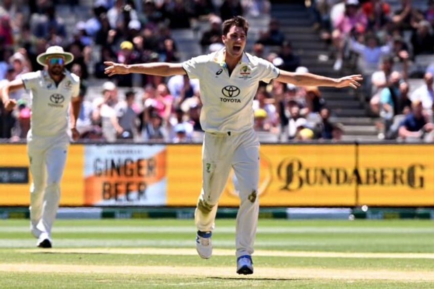 Australian bowler Pat Cummins (C) celebrates another wicket against Pakistan