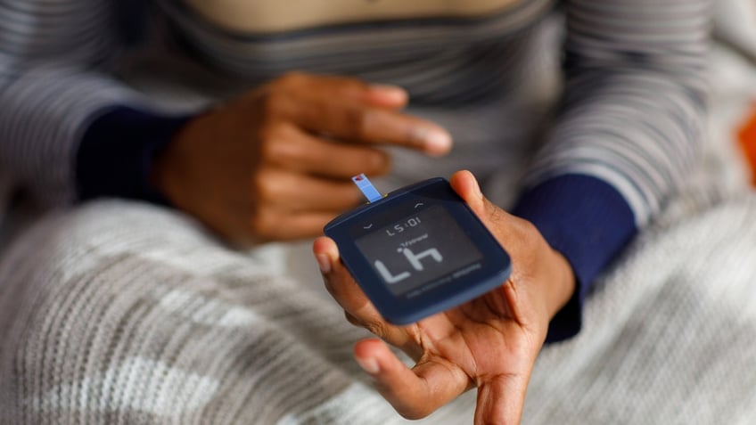 Woman checking glucose levels