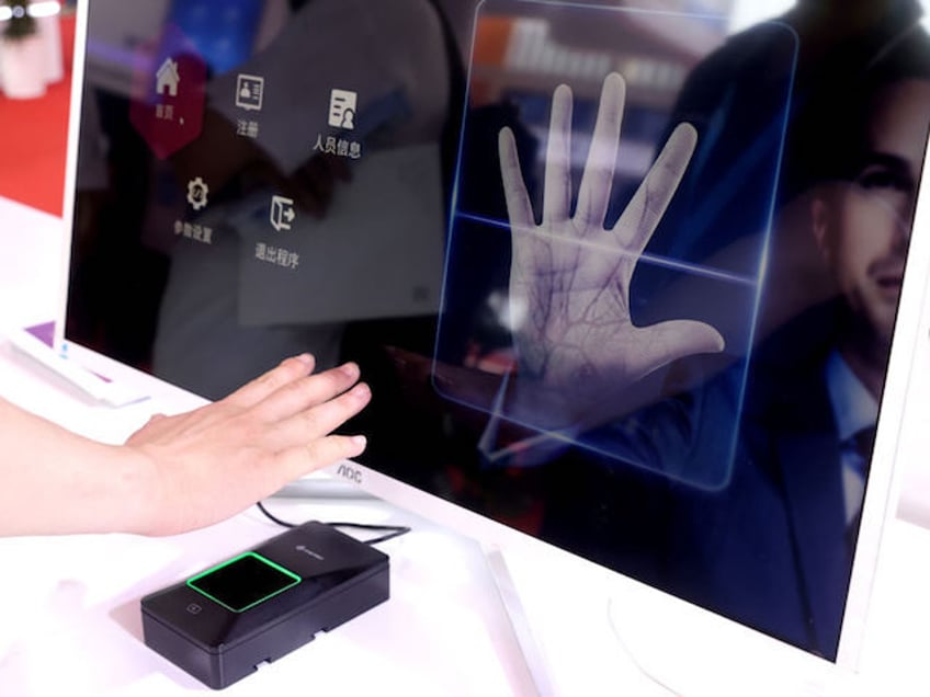 BEIJING, CHINA - JUNE 07: A exhibitor demonstrates Palm Recognition Access Control System during 2023 China International Exhibition on Public Safety and Security on June 7, 2023 in Beijing, China. (Photo by Zhang Yu/China News Service/VCG via Getty Images)