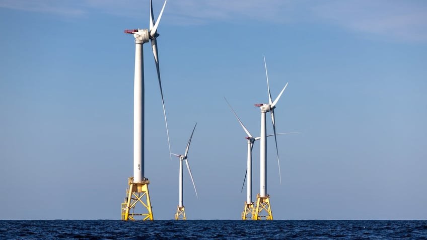 AT SEA - JULY 07: Wind turbines generate electricity at the Block Island Wind Farm on July 07, 2022 near Block Island, Rhode Island. The first commercial offshore wind farm in the United States is located 3.8 miles from Block Island, Rhode Island in the Atlantic Ocean. The five-turbine, 30 MW project was developed by Deepwater Wind and began operations in December, 2016 at a cost of nearly $300 million. (Photo by John Moore/Getty Images)