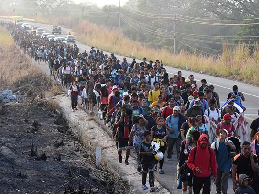 Migrants walk along the highway through Arriaga, Chiapas state in southern Mexico, Monday, Jan. 8, 2024, during their journey north toward the U.S. border. (AP Photo/Edgar H. Clemente)