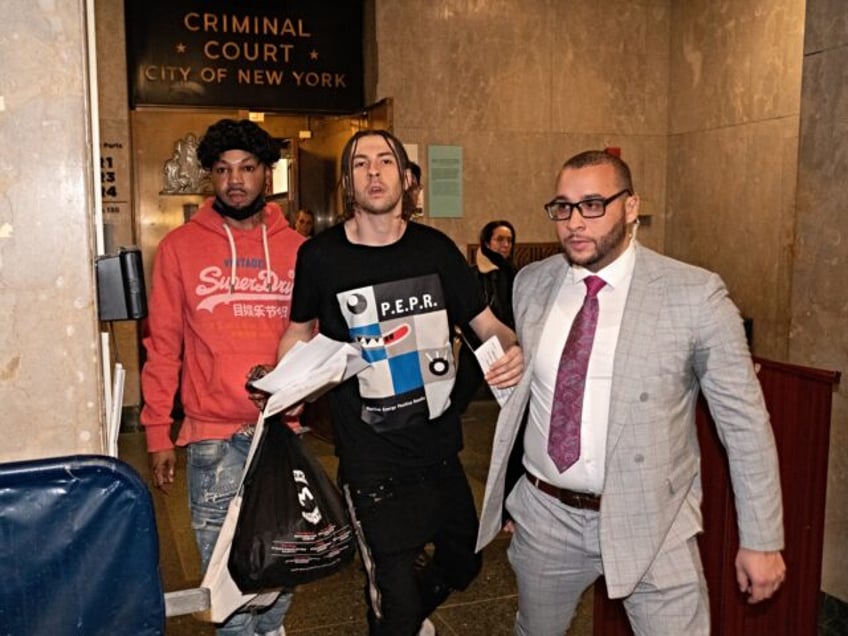 UNITED STATES -February 9: Declyn Lauper is escorted by his personal security out of Manha