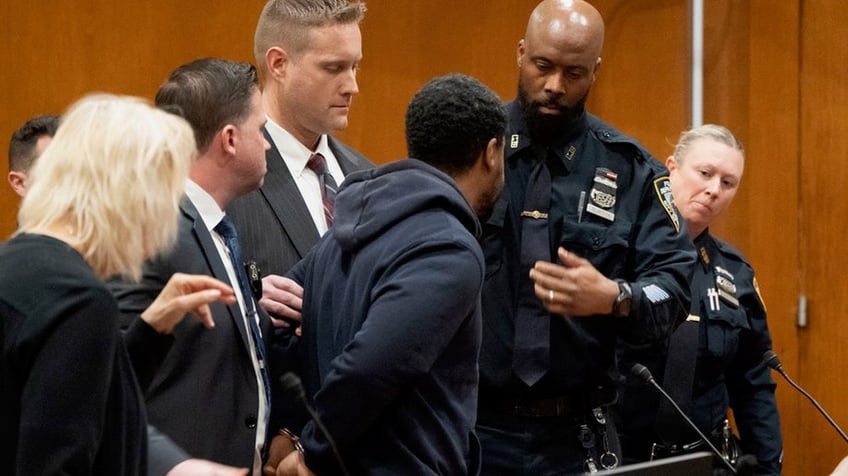 Jones walking away in court