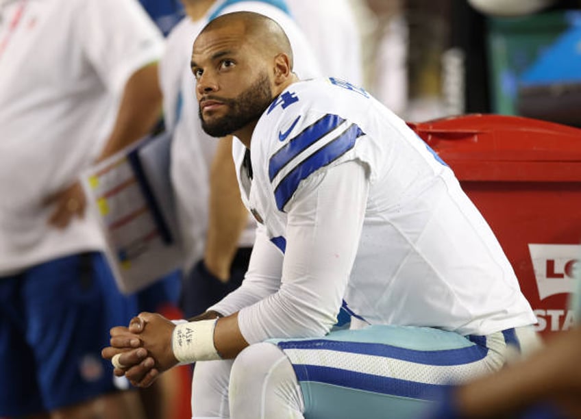 Dak Prescott of the Dallas Cowboys reacts on the bench during the fourth quarter against the San Francisco 49ers at Levi's Stadium on October 08,...