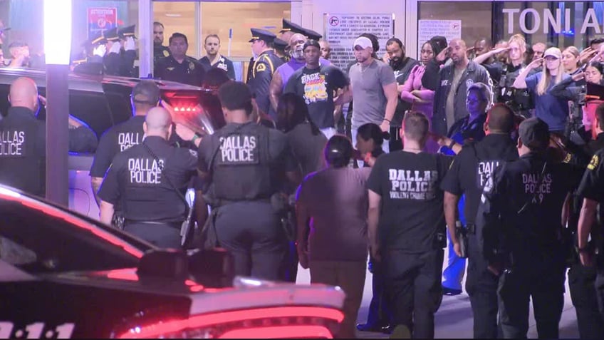 Dallas Police officers salute