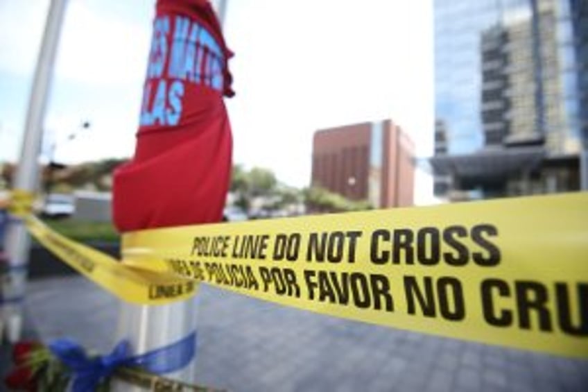 Dallas police officer shot, killed in patrol car; shootout injures 2 responding officers