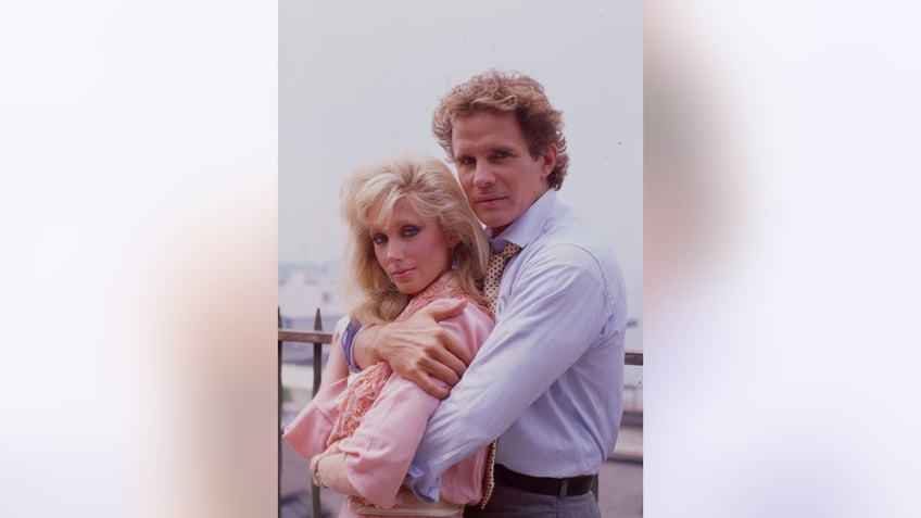 Dack Rambo embracing Morgan Fairchild.