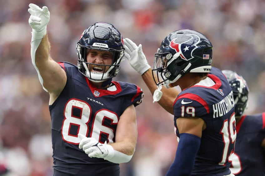 Dalton Schultz and Xavier Hutchinson of the Houston Texans react during the game against the New Orleans Saints at NRG Stadium on October 15, 2023 in...