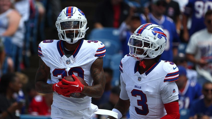 Dane Jackson celebrates with Damar Hamlin