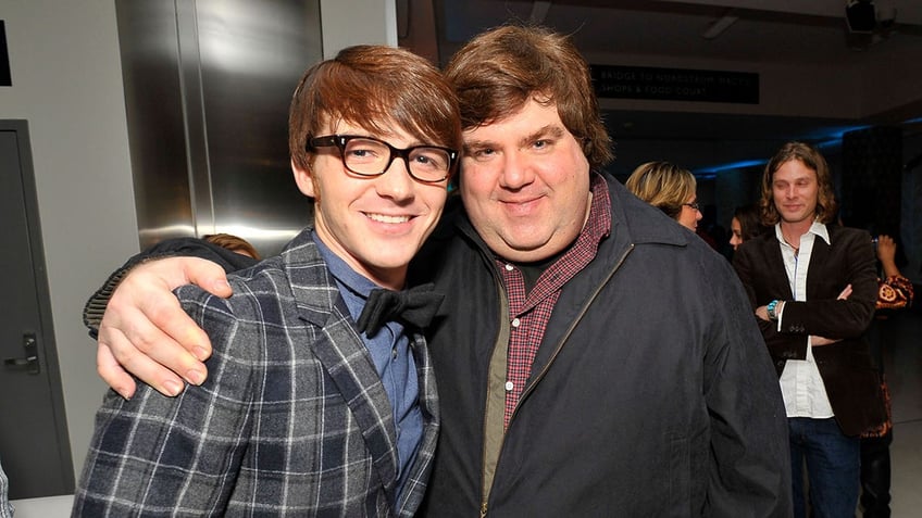 Drake Bell and Dan Schneider posing together in 2002