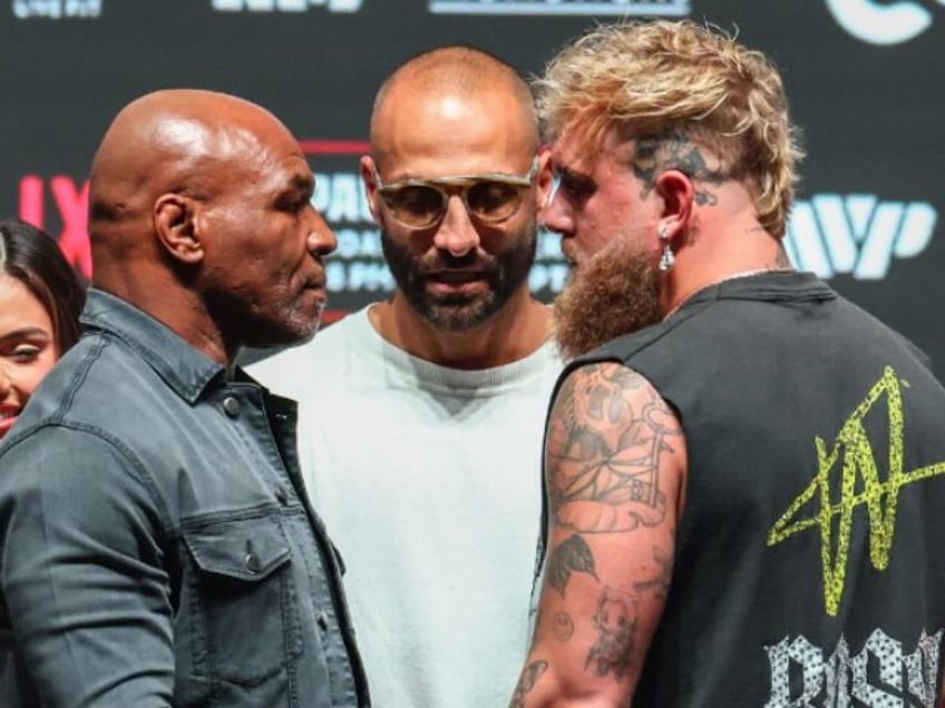 IRVING, TEXAS - NOVEMBER 13: Mike Tyson and Jake Paul pose after the final press conferenc