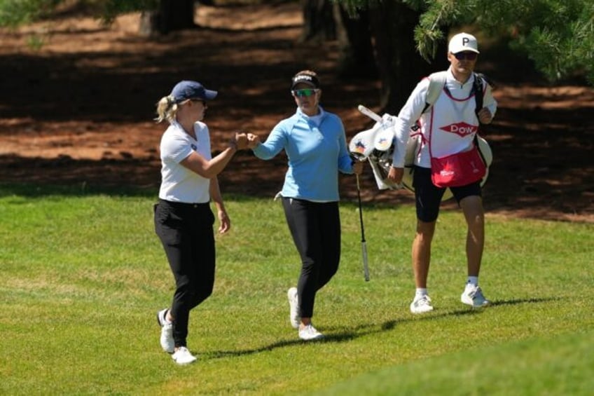 Denmark's Nicole Broch Estrup, left, and Nanna Koerstz Madsen, center, combined to shoot a