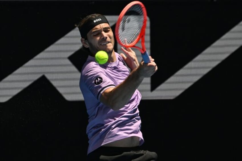 Taylor Fritz hits a return during his emphatic win against Chile's Cristian Garin at the A