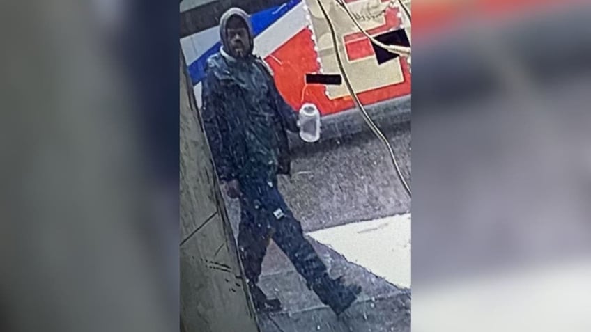 A CCTV image of a man wanted for setting another man