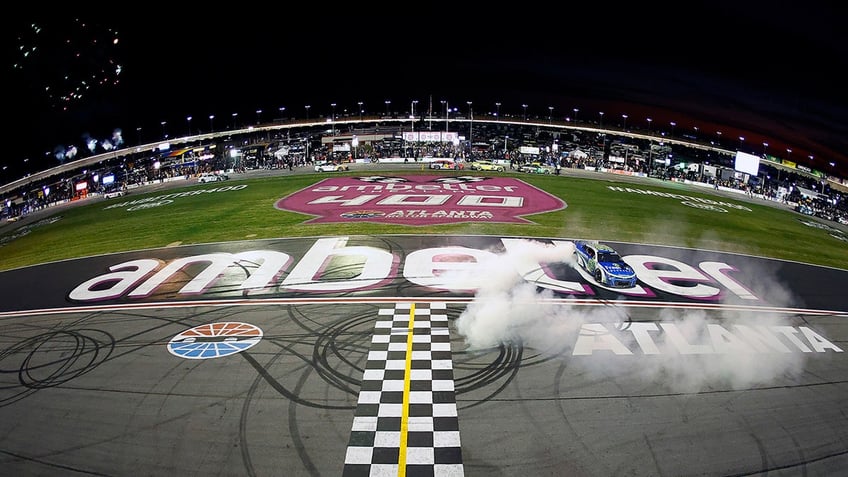 Daniel Suarez celebrates