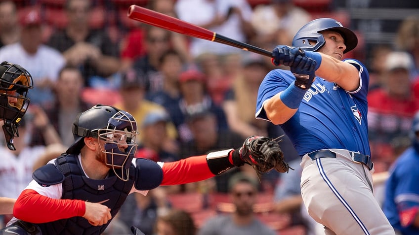 Daulton Varsho swings