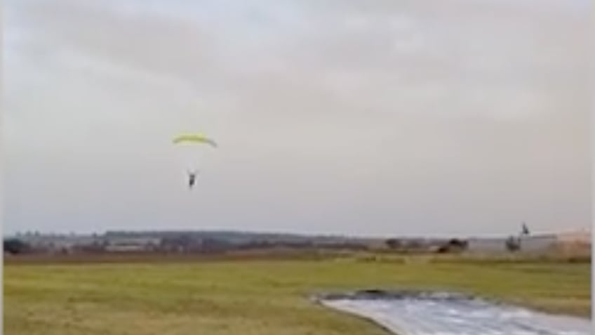 daredevil skydiver makes perfect landing on bizarre pool toy coming for ya