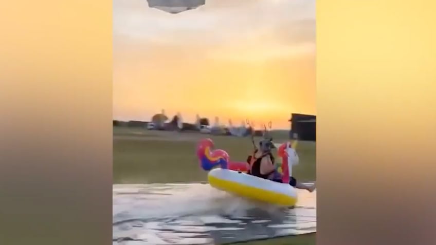 daredevil skydiver makes perfect landing on bizarre pool toy coming for ya