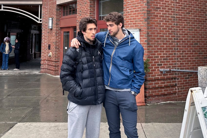 Dartmouth basketball players Romeo Myrthil, left, and Cade Haskins talk after voting at Dartmouth College in Hanover, N.H., Tuesday, March 5, 2024. The Dartmouth men's basketball team has voted to unionize, taking an unprecedented step toward forming the first-ever labor union for college athletes. (AP Photo/Jimmy Golen)